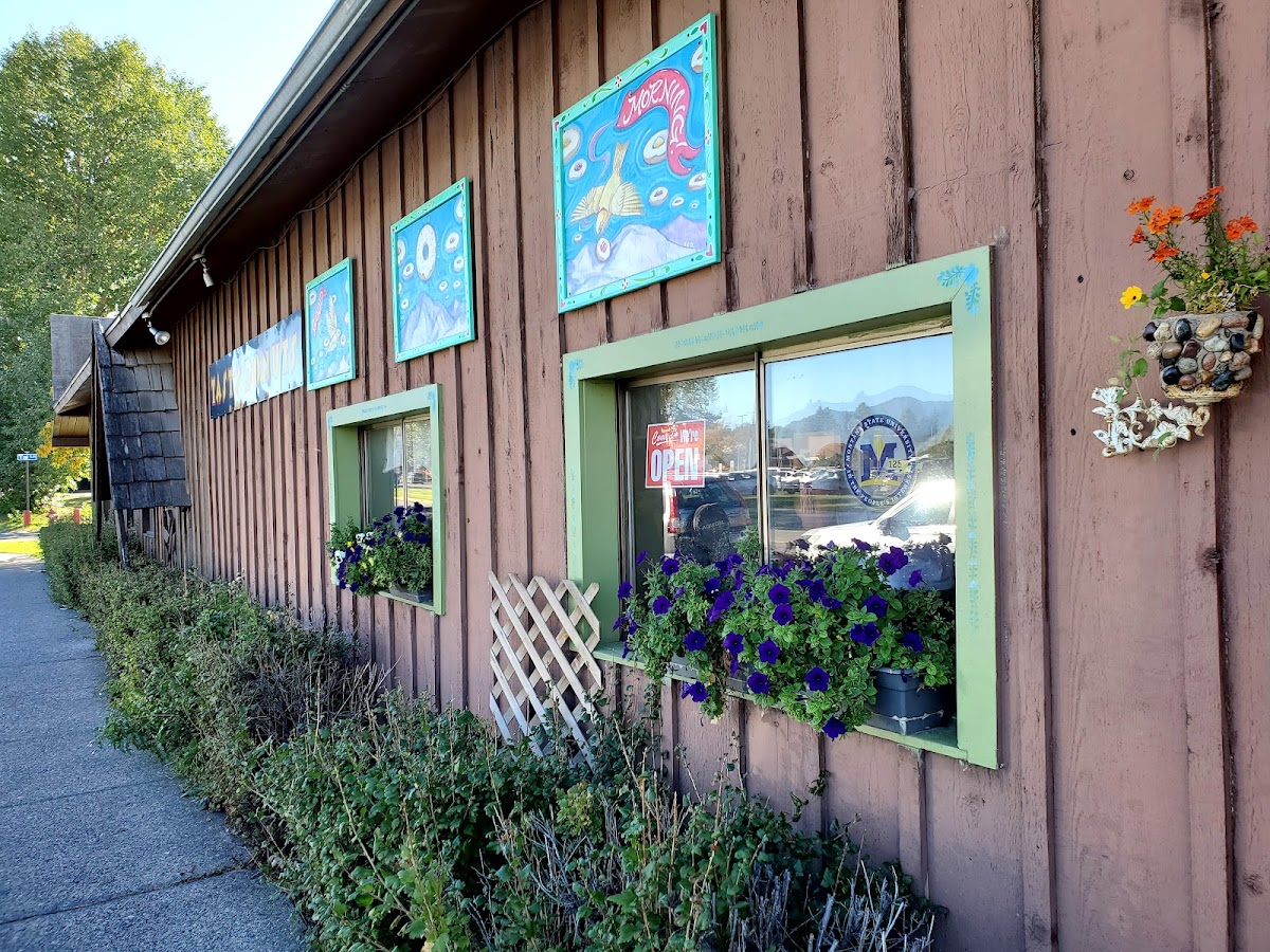Granny's storefront with hand-painted donut murals and flower boxes