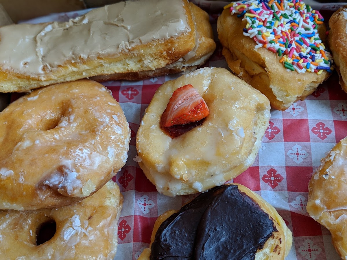An assortment of Granny's donuts on checkered paper